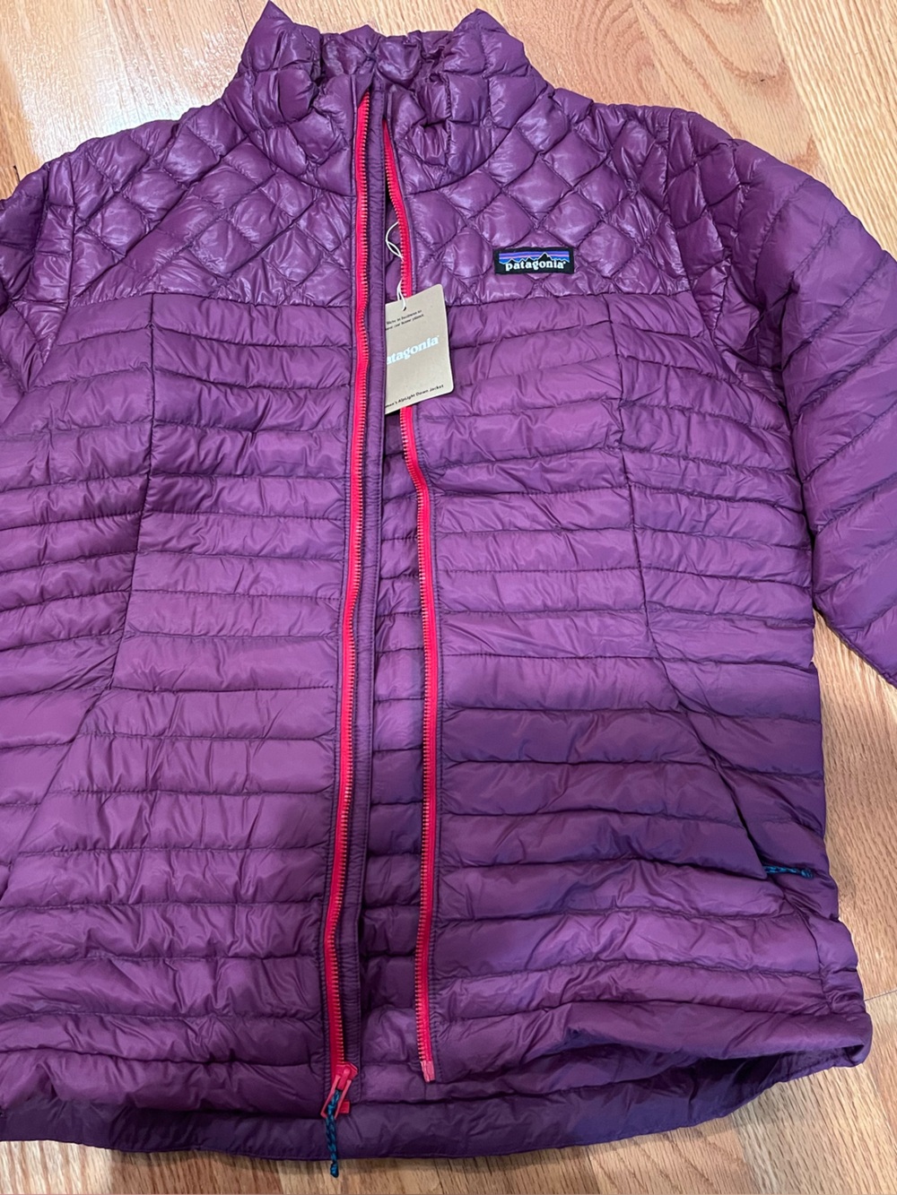 Patagonia Women's ultra light down Jacket in Purple with red Trim